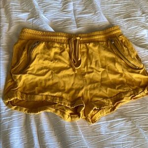 Yellow shorts with silver zippers